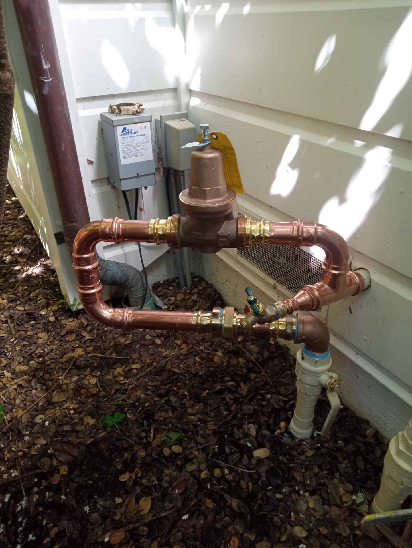 Copper main water line loop with a bronze pressure regulator